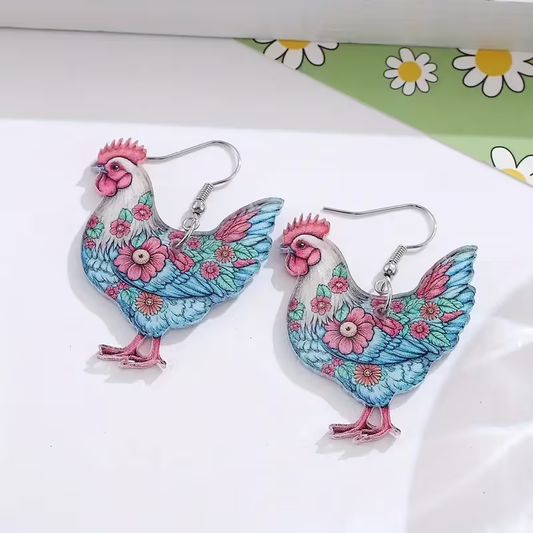 Chicken-shaped pendant earrings featuring soft blue feathers